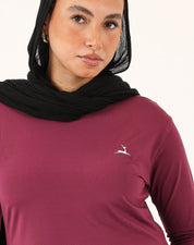 Close-up of fabric texture on burgundy Doe Modest Flow Top