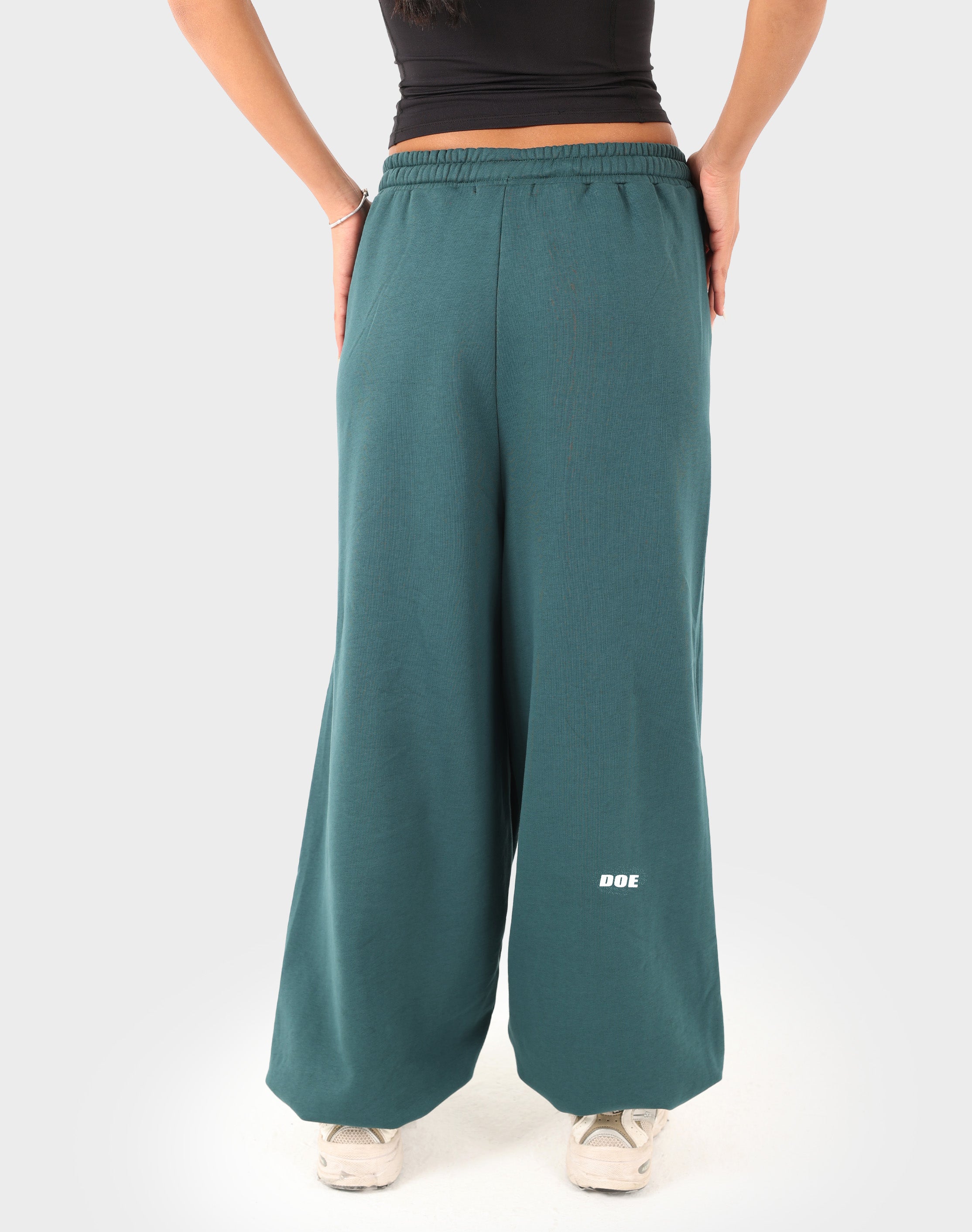 Teal green Doe Cloud Fit Pants — rear view showing drape